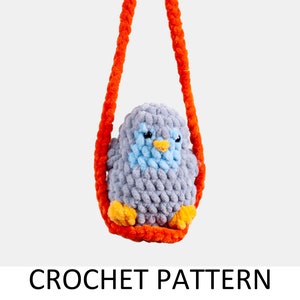 May include: A handmade crochet bird in a swing. The bird is gray with a blue chest and yellow feet. The swing and hanging cord are bright orange. The text "CROCHET PATTERN" is below the image.