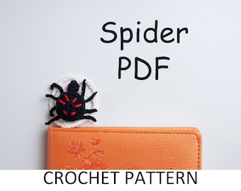 Spinne Lesezeichen mit Häkelanleitung. Halloween Lesezeichen Muster gehäkelt. Gehäkelte Spinnen-Anleitung. Spinnennetz Muster
