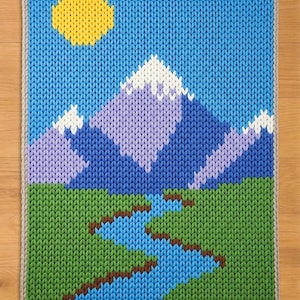 Modèle de tricot avec les doigts de paysage de montagne. Modèle de couverture en tricot épais. Motif de couverture épaisse nature
