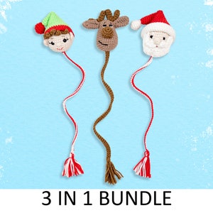 Könnte beinhalten: Ein Set aus drei gehäkelten Weihnachts-Lesezeichen-Anhängern. Die Anhänger sind in Form eines Elfen, eines Rentiers und des Weihnachtsmanns geformt. Jeder Anhänger hat einen roten und weißen Quasten.