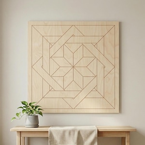 May include: A large, square wooden wall art piece with a geometric design. The artwork features a series of interconnected lines and shapes, creating a star-like pattern in the center. The wood has a natural, light-brown color, and the piece is mounted on a white wall.