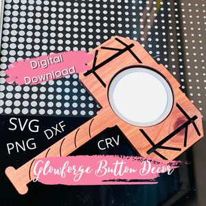 May include: A wooden button with a circular cutout in the center. The button is shaped like a hammer with a handle and a head. The text "Glowforge Button Decor" is visible in the image.