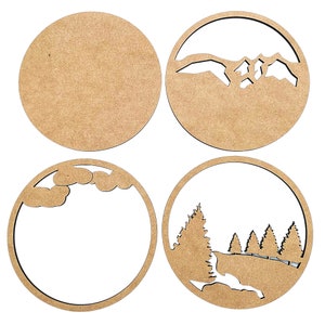 May include: Four round wooden plaques with different designs cut out. The first plaque is blank. The second plaque has a mountain range cut out. The third plaque has a cloud cut out. The fourth plaque has a forest scene cut out.