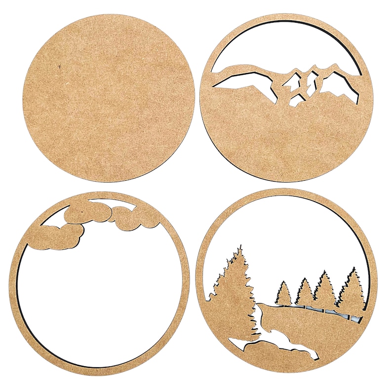 May include: Four round wooden plaques with different designs cut out. The first plaque is blank. The second plaque has a mountain range cut out. The third plaque has a cloud cut out. The fourth plaque has a forest scene cut out.