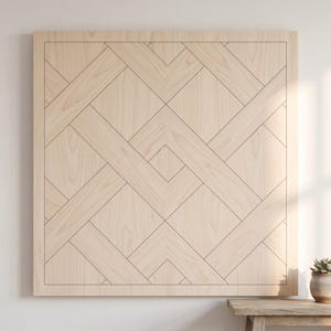 May include: A light-colored wooden wall panel with a geometric design. The panel features a series of intersecting lines and shapes, creating a pattern. The wood grain is visible, adding texture. The panel is square and mounted on a white wall.