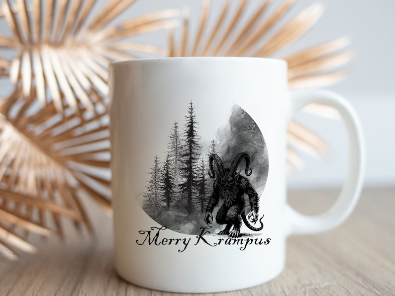 May include: White ceramic mug with a black and white illustration of a monster in a forest with the text "Merry Krampus".