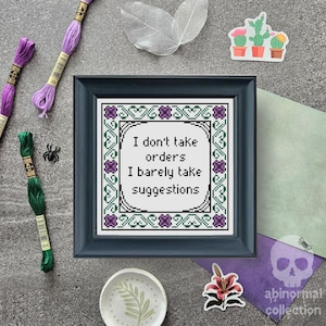 May include: Cross stitch pattern with a green and purple border and the text "I don't take orders I barely take suggestions".