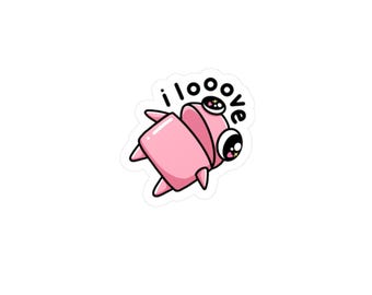 May include: A pink sticker featuring a cartoon creature with large eyes and the text "i love". The creature has a rectangular body and small pointed legs. The eyes have star-shaped highlights.