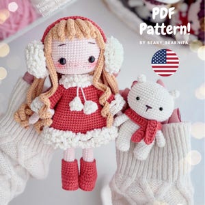 May include: Crochet pattern for a girl doll wearing a red dress and white earmuffs, and a white bear wearing a red scarf. The pattern is available as a PDF download. The text on the image reads "PDF Pattern! By Beary_Bearnita_"