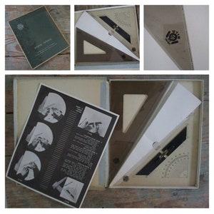 May include: A white box containing a clear plastic protractor and instructions. The protractor is labelled "Made in Israel" and the instructions are in Hebrew. The box is open and the protractor is visible.