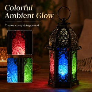 May include: A black metal lantern with a circular top handle and intricate cut-out patterns. The lantern features panels of textured glass in red, blue, and green. Text on the image reads: Colorful Ambient Glow. Creates a cozy vintage mood.