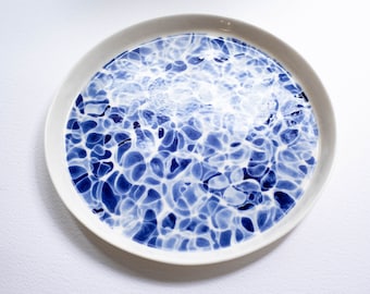 Handpaited plate with a motif inspired by the surface of flashing water, porcelain