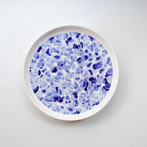 Handpaited plate with a motif inspired by the surface of flashing water, porcelain