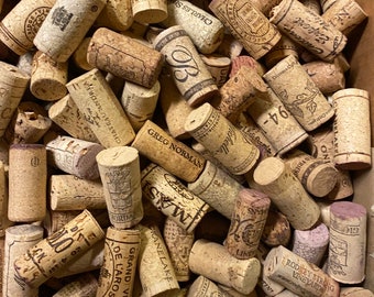 A random selection of used wine corks, some with vintage years. Top