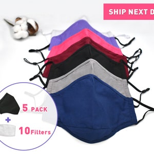 May include: A set of five reusable face masks in various colors, including purple, pink, maroon, black, gray, and blue. The masks are made of a soft, breathable fabric and have adjustable ear loops. The set also includes 10 filters.  5 PACK + 10 Filters