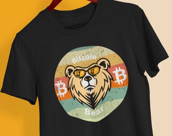 May include: Black t-shirt with a retro-style graphic of a bear wearing sunglasses and the text "Bitcoin Bear" with a Bitcoin symbol on either side of the bear.