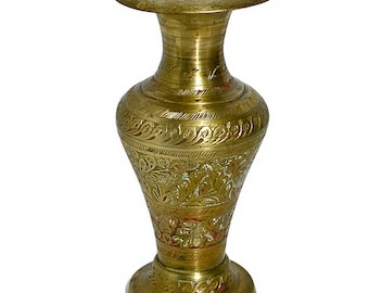 May include: A gold brass vase with intricate floral designs and red accents. The vase has a wide mouth and a narrow base.
