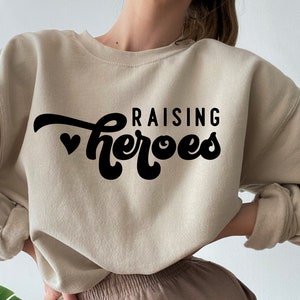 Raising Heroes Svg, Teacher Svg, Mom Quotes Svg, Mom Shirt Svg, Teacher Quotes Svg, Inspirational Svg, Autism Mom Svg Cut File