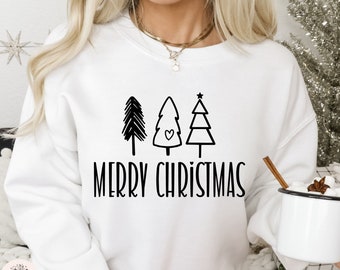 May include: White sweatshirt with a black graphic of three stylized Christmas trees and the text "Merry Christmas".
