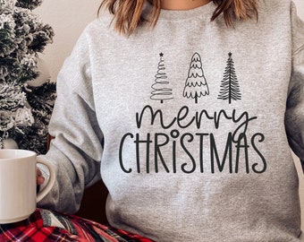 May include: A gray sweatshirt with a black graphic of three stylized Christmas trees and the text "merry christmas".