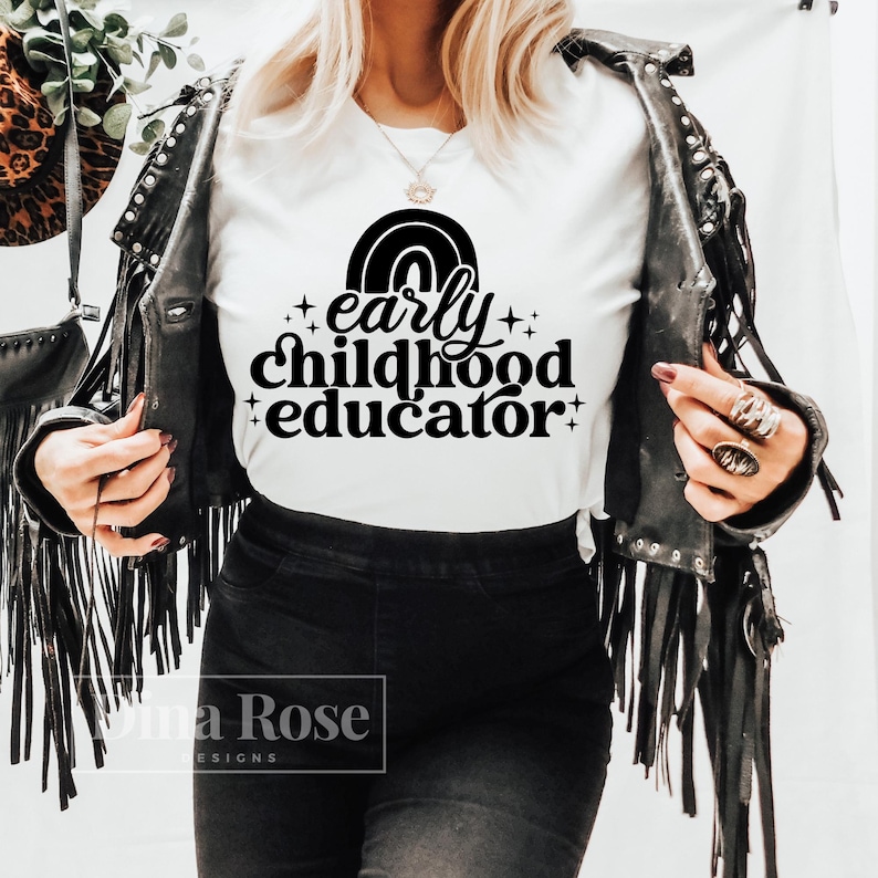 May include: White t-shirt with black text that reads "early childhood educator" with a rainbow graphic above the text.