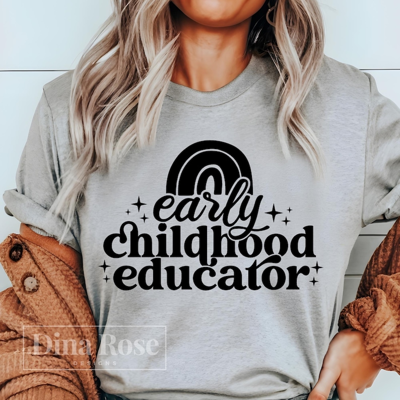 May include: A gray t-shirt with a black rainbow and the text "early childhood educator" in a retro font.