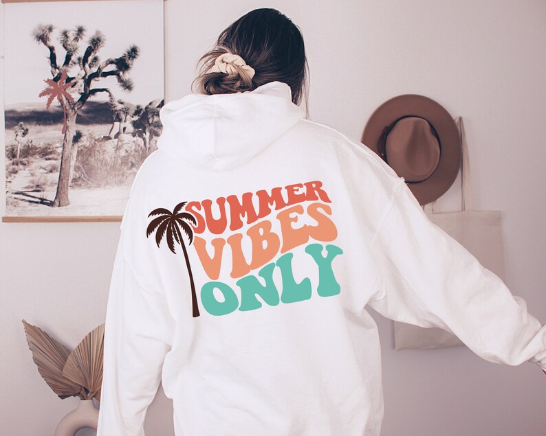 May include: White hoodie with a palm tree and the text "SUMMER VIBES ONLY" in colorful retro font.