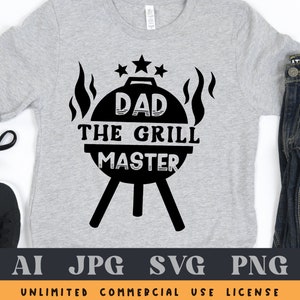 May include: A gray t-shirt with black text that reads "Dad The Grill Master" with a grill graphic and flames.