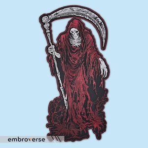 May include: Embroidered patch depicting a skeletal figure in a red hooded robe, holding a scythe. The figure is standing on a black background with a white outline.