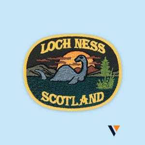 May include: Embroidered patch featuring the Loch Ness Monster in a lake scene with a sunset backdrop. The patch is oval-shaped with the words "LOCH NESS SCOTLAND" in yellow lettering.