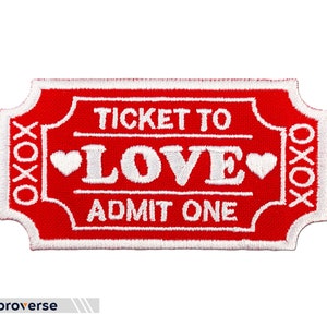 May include: Red embroidered iron-on patch with white text that reads "Ticket to Love Admit One" with two small hearts on either side of the word "Love".
