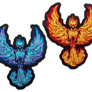 May include: Two embroidered iron-on patches of phoenixes, one with blue and purple flames and the other with orange and red flames.