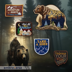 May include: Five embroidered patches with nature and adventure themes. The patches feature a bear in a forest, a camper van, mountains, and the text "Adventure Awaits", "Not All Who Wander Are Lost", "Take A Hike", and "Embrace Your Wild".