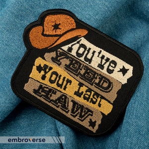 May include: Black embroidered patch with a cowboy hat and the text "You've Yee'd Your Last Haw".