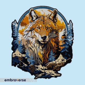 May include: A colorful embroidered patch featuring a wolf's head with a forest background. The wolf is brown, orange, and yellow, with a white muzzle. The background is blue and green, with trees and mountains.