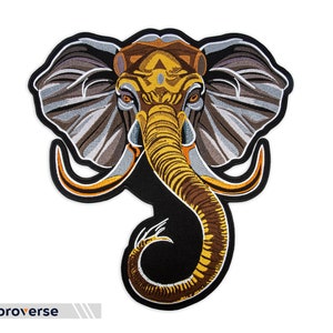 May include: Embroidered elephant patch featuring a detailed design with brown, gold, gray, and black colors. The elephant's head and trunk are prominently displayed, with intricate stitching and a black border. The text "embroverse" is at the bottom.