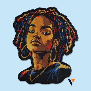 May include: Embroidered patch featuring a portrait of a woman with brown skin, gold hoop earrings, and a gold chain. Her hair is styled in colorful dreadlocks. The patch has a black border and is set against a light blue background.