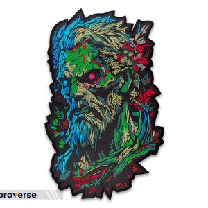 Peut inclure: Un patch brodé coloré représentant un visage de zombie avec un schéma de couleurs vert et bleu. Le visage est entouré de feuillage rouge et vert.