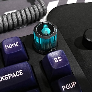 Toetsenbordknop - Transparant turquoise / ondoorzichtig zwart - D-as - Opklikbaar
