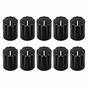 May include: A set of ten black cylindrical control knobs arranged in two rows of five. Each knob features a scalloped top edge, a smooth glossy finish, and a single vertical white indicator line centred on the top surface.
