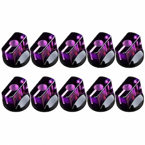 May include: A set of ten translucent purple control knobs arranged in two rows of five. Each knob features a cylindrical shape with a flat top, a circular indentation, and a vertical white indicator line running down the side for precise adjustment.