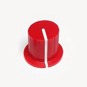 May include: A red control knob with a white indicator line. The knob has a cylindrical shape with a circular base. The design is simple and modern, suitable for audio equipment or other electronic devices.