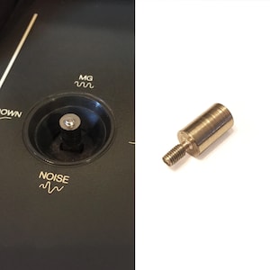 May include: A close-up of a silver metal knob with a threaded shaft. The knob is about 2.5 cm in diameter and 3.8 cm long. The shaft is about 1.3 cm long.