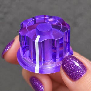 Botão giratório roxo transparente