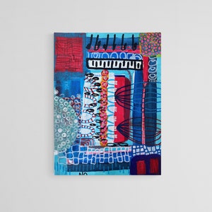 May include: Abstract painting with a mix of blue, red, and white colors. The painting features geometric shapes, lines, and patterns. The painting is framed and ready to hang.