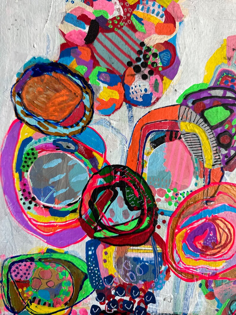 May include: Abstract painting with bright colours and bold shapes. The painting features circles, swirls, and lines in shades of pink, blue, green, yellow, orange, and red.