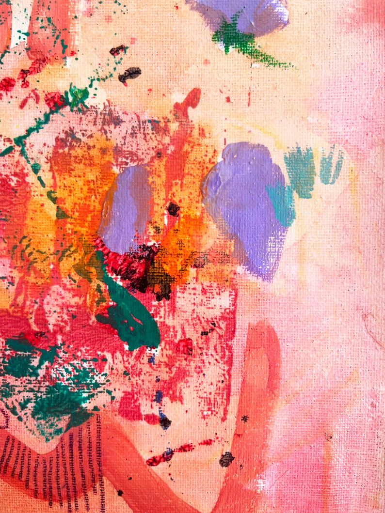 May include: Abstract painting with splashes of purple, orange, red, green, and black paint on a pink canvas.