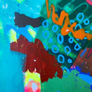 May include: Abstract painting with a mix of green, blue, orange, and brown paint. The painting features a variety of shapes and textures, including circles, swirls, and splatters.