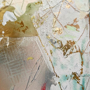 May include: Abstract painting with a textured white background and gold accents. The painting features a variety of colors, including green, blue, and pink. The gold accents are applied in a layered and textured way, creating a sense of depth and dimension.