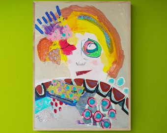 May include: Abstract painting on canvas featuring a whimsical face with a large eye and a smile. The artwork uses bright colors like yellow, orange, pink, and blue, with a beige background and a wooden frame. The style is expressive and playful.